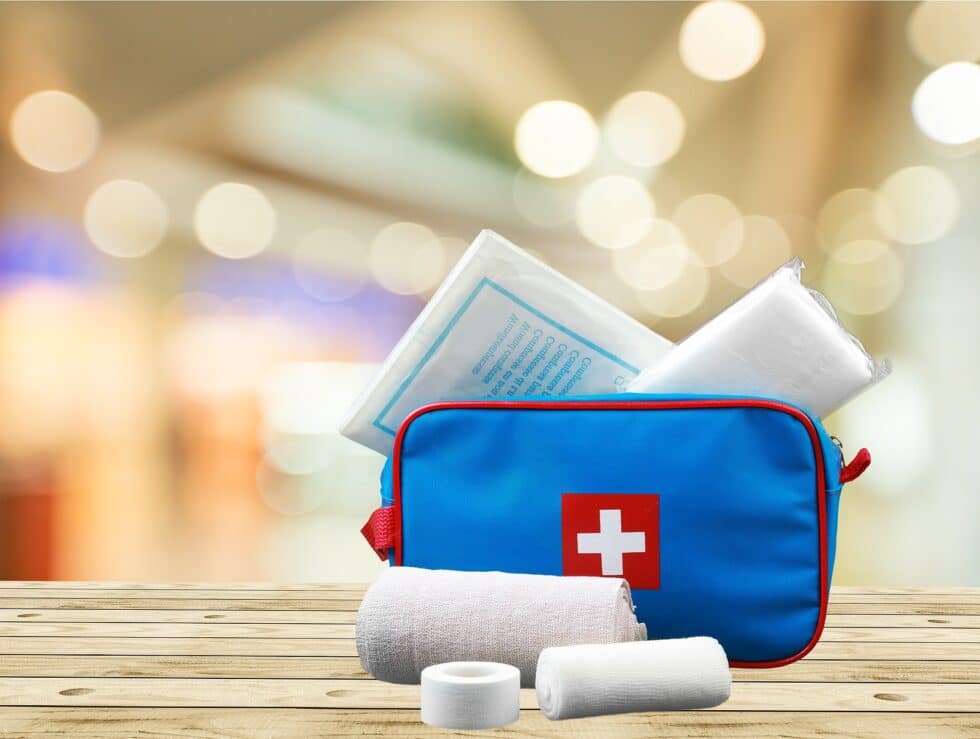 Resort Concierge Escapes illustrates a compact first aid kit as part of thoughtful international travel preparation.